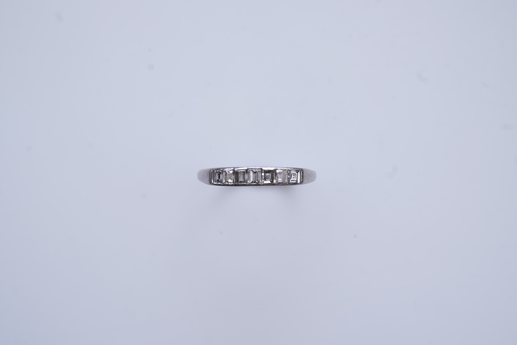 A diamond half-eternity ring, first half 20th century